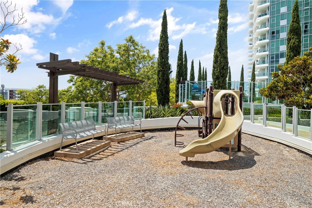 3141 Michelson Drive, Unit 907 Irvine, CA 92612 - Photo 47 of 48 a house view with a garden space and outdoor seating