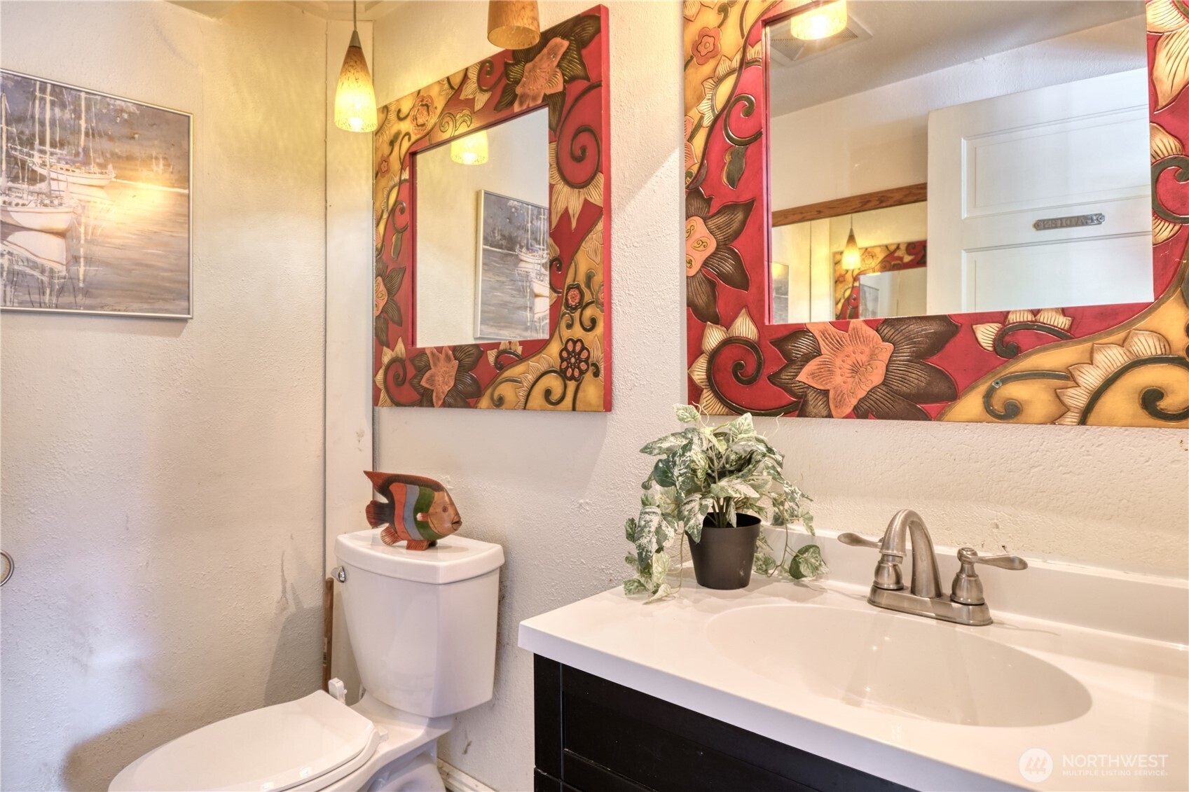 1379 Gulf Road Point Roberts, WA 98281 - Photo 13 of 37 a bathroom with a sink a toilet and a mirror