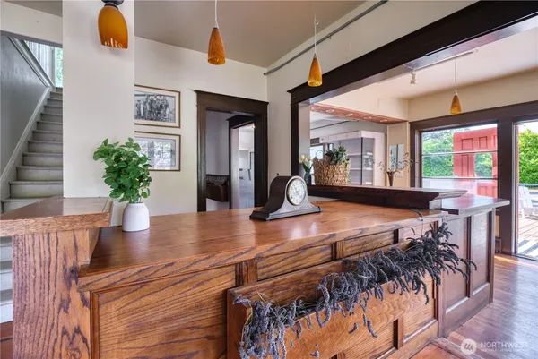 a dining room with furniture and wooden floor