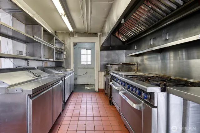 a kitchen with a stove and a sink