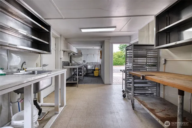 a kitchen with stainless steel appliances granite countertop a stove and a refrigerator