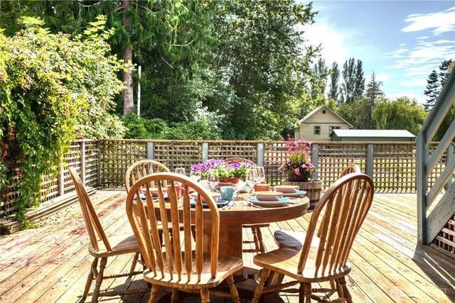 a view of a chairs and table in the balcony
