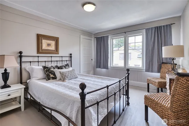 a bedroom with a bed and a couch