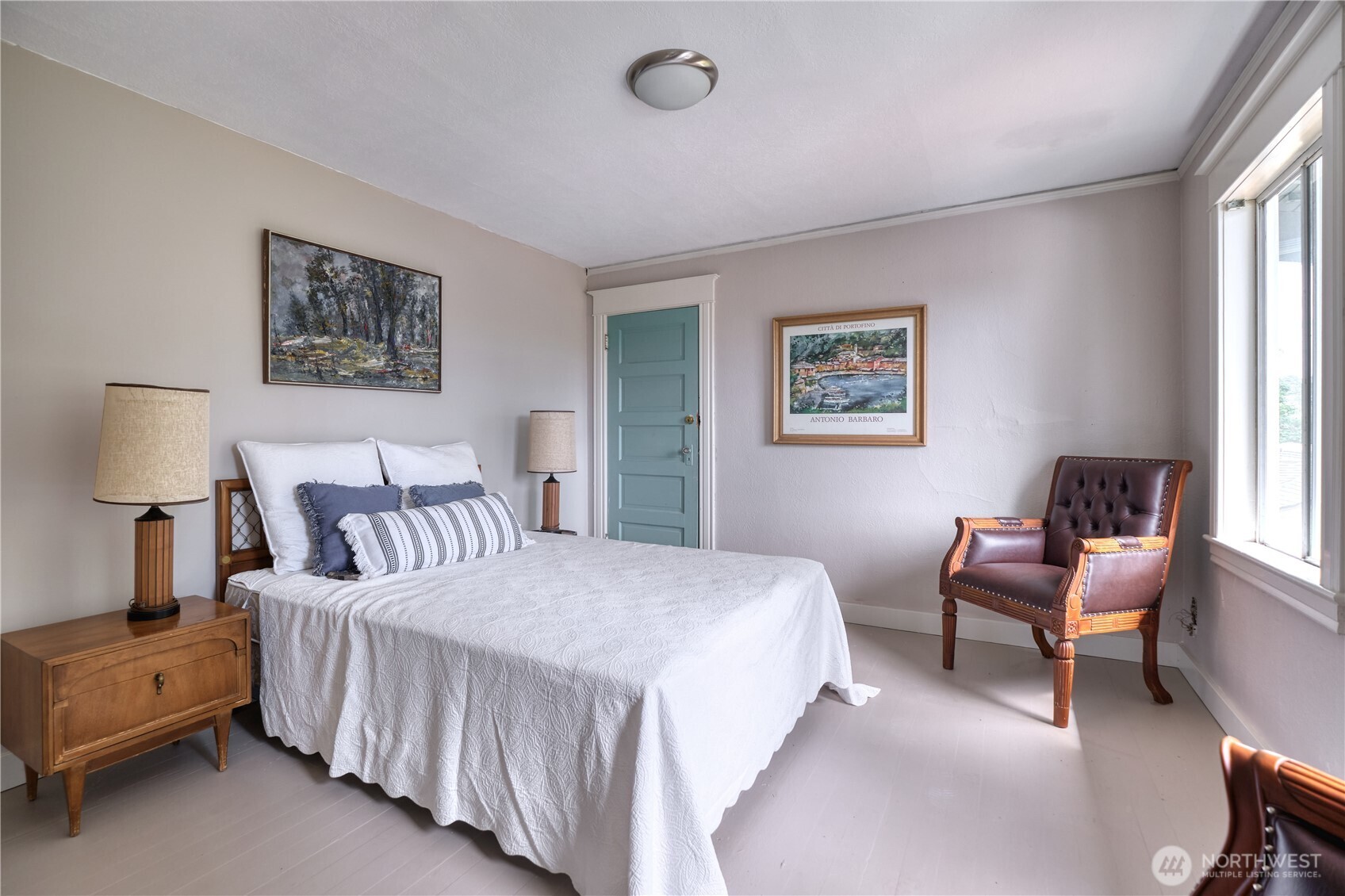 1379 Gulf Road Point Roberts, WA 98281 - Photo 24 of 37 a bedroom with a bed and a lamp on dresser