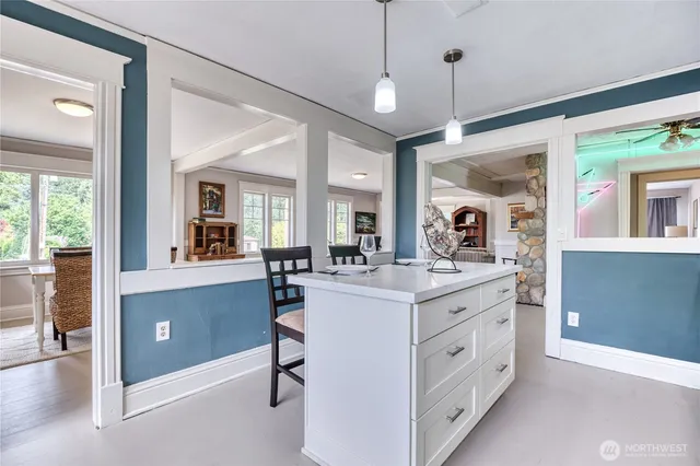 a view of living room with granite countertop furniture and a flat screen tv