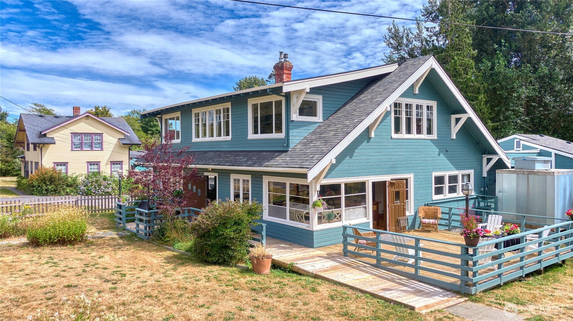 1379 Gulf Road Point Roberts, WA 98281 - Photo 3 of 37 a front view of a house with a yard