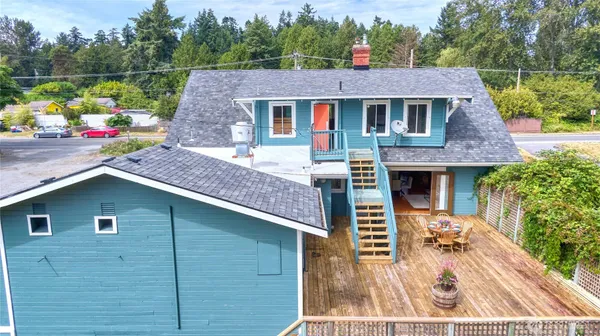 an aerial view of a house with outdoor space