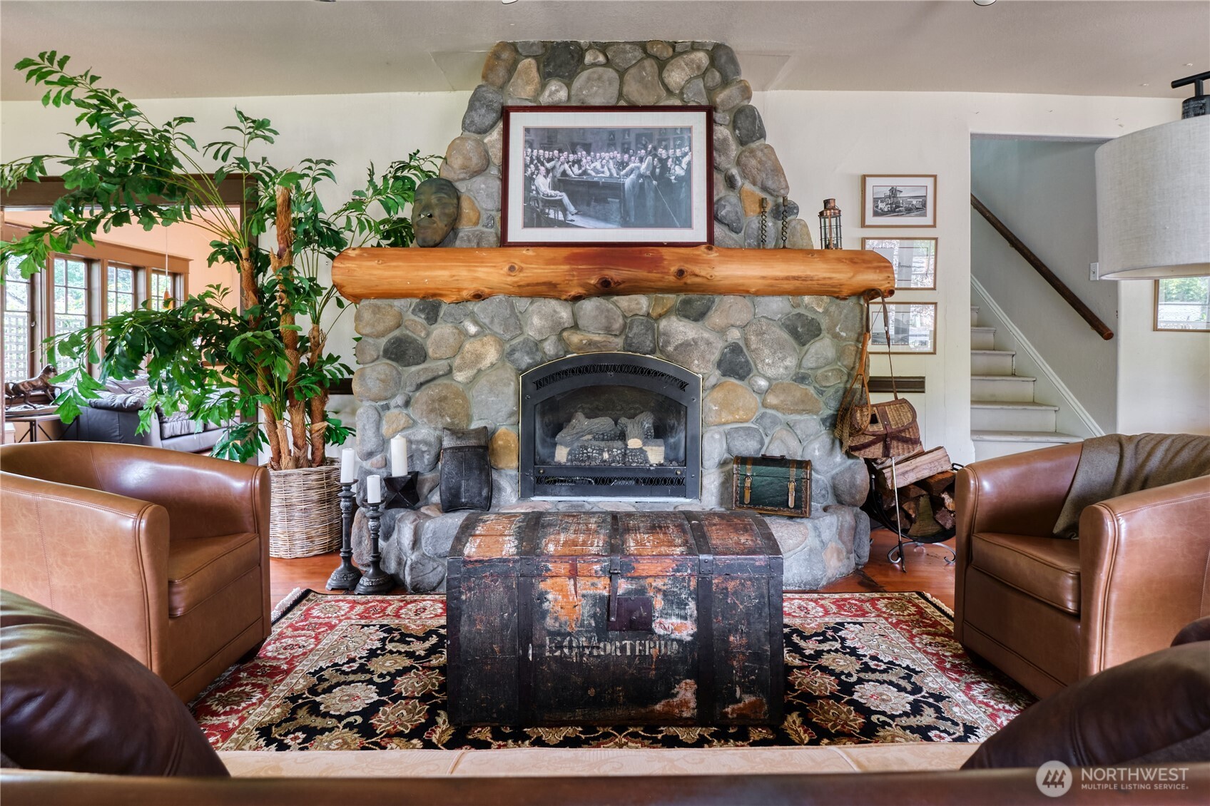 1379 Gulf Road Point Roberts, WA 98281 - Photo 6 of 37 a living room with furniture and a fireplace
