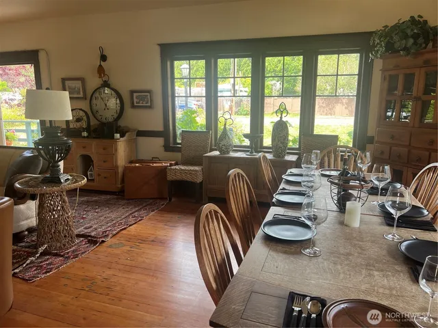 a view of a livingroom with furniture hardwood floor and a chandelier