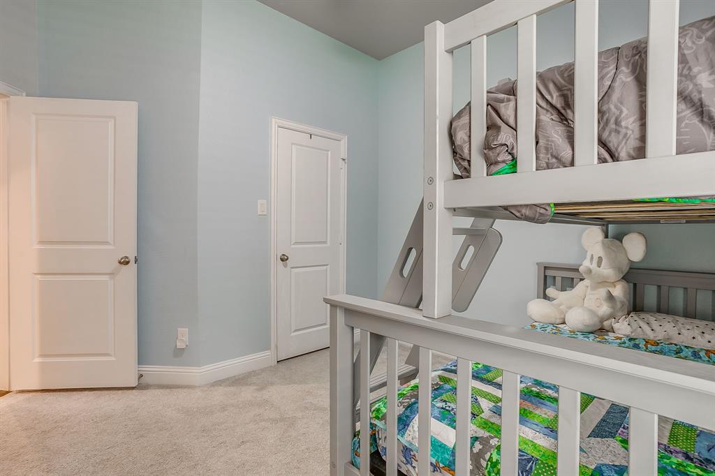 15141 Fleet Hill Road Aledo, TX 76008 - Photo 25 of 37 Bedroom 4 with carpet, ceiling fan and walk in closet.
