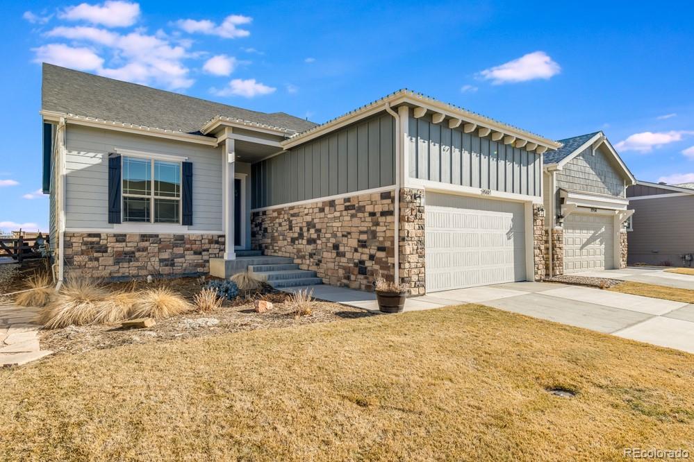 2944 Zephyr Road Fort Collins, CO 80528 - Photo 2 of 35 a front view of a house with a yard