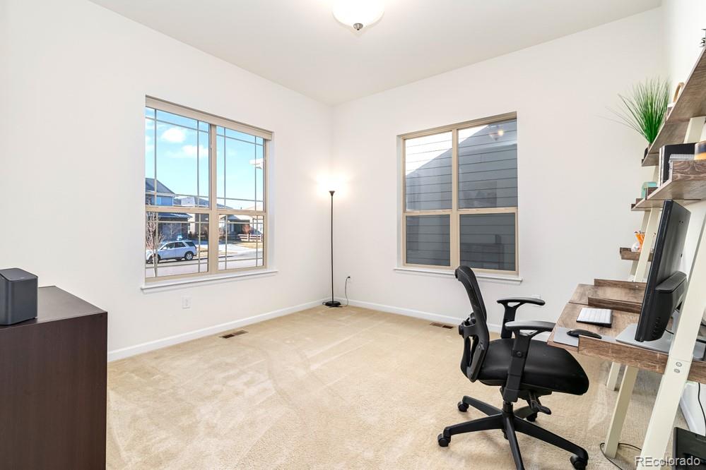 2944 Zephyr Road Fort Collins, CO 80528 - Photo 23 of 35 a view of a workspace with furniture and a window