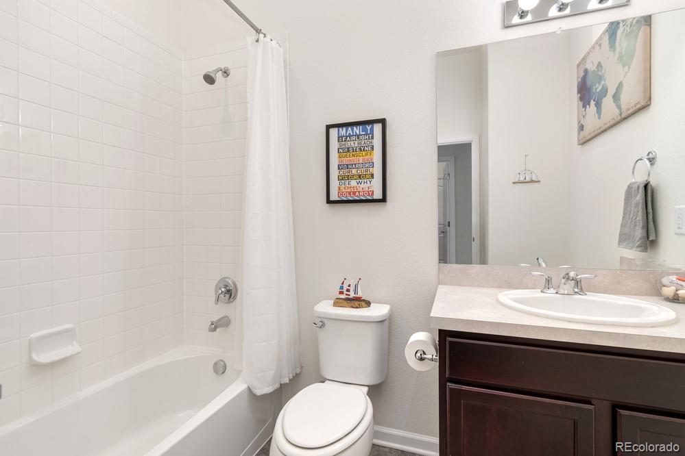 2944 Zephyr Road Fort Collins, CO 80528 - Photo 26 of 35 a bathroom with a sink a toilet and shower