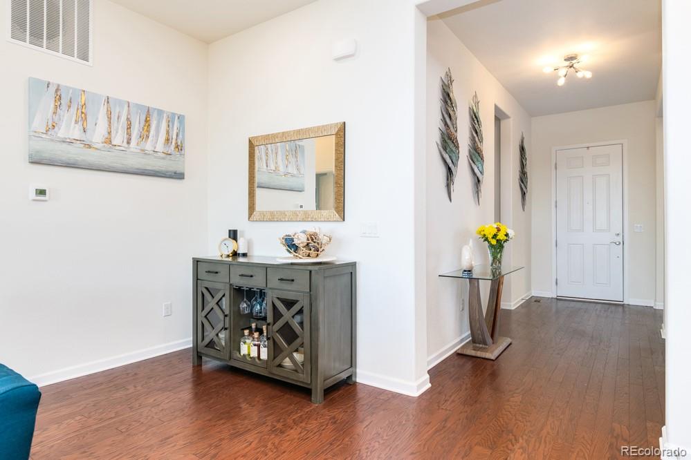 2944 Zephyr Road Fort Collins, CO 80528 - Photo 3 of 35 a view of an entryway with wooden floor