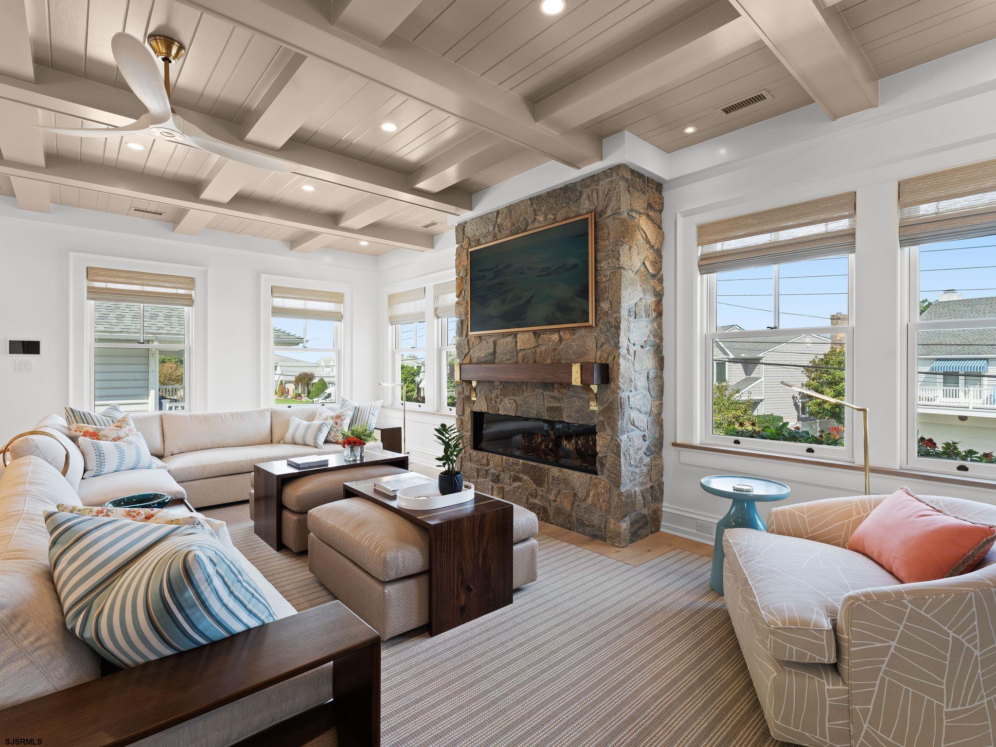 12 East Newcastle Road Ocean City, NJ 08226 - Photo 16 of 99 a living room with furniture fireplace and a large window