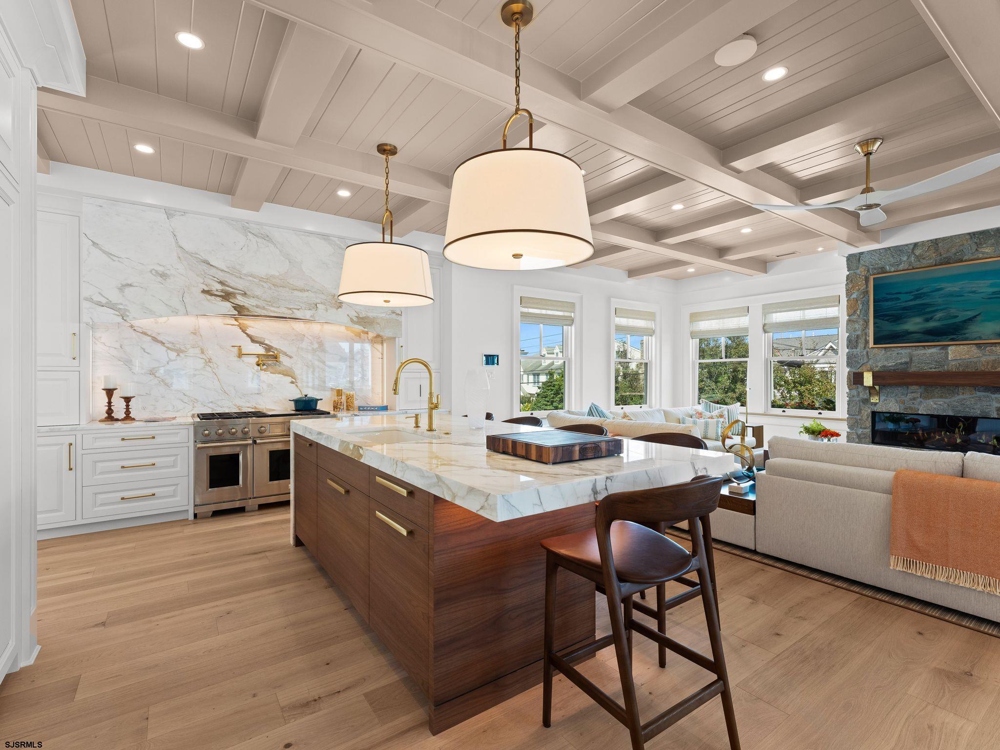 12 East Newcastle Road Ocean City, NJ 08226 - Photo 20 of 99 a kitchen with stainless steel appliances granite countertop a stove oven and a refrigerator with cabinets