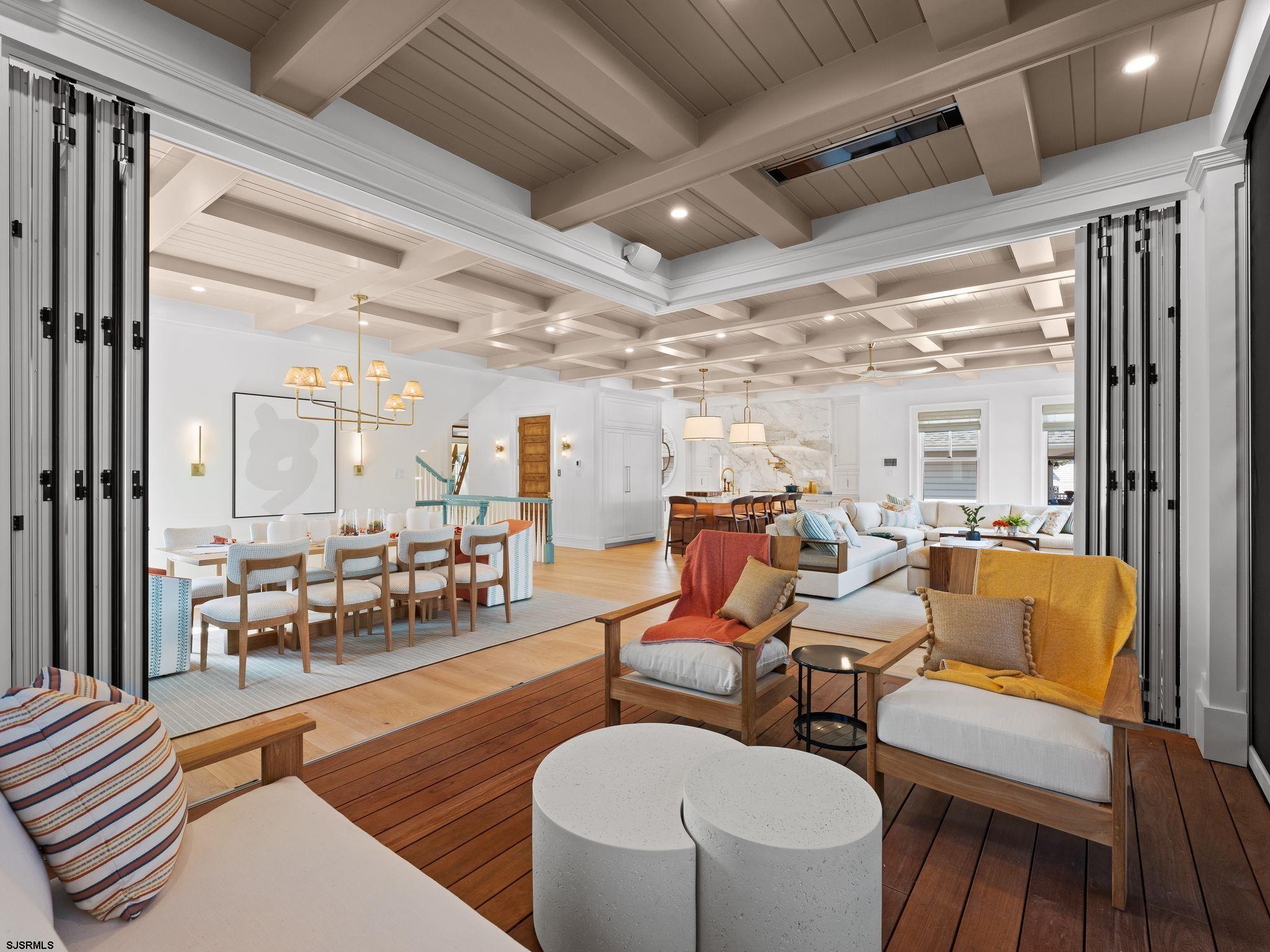 12 East Newcastle Road Ocean City, NJ 08226 - Photo 32 of 99 a living room with furniture and a large window