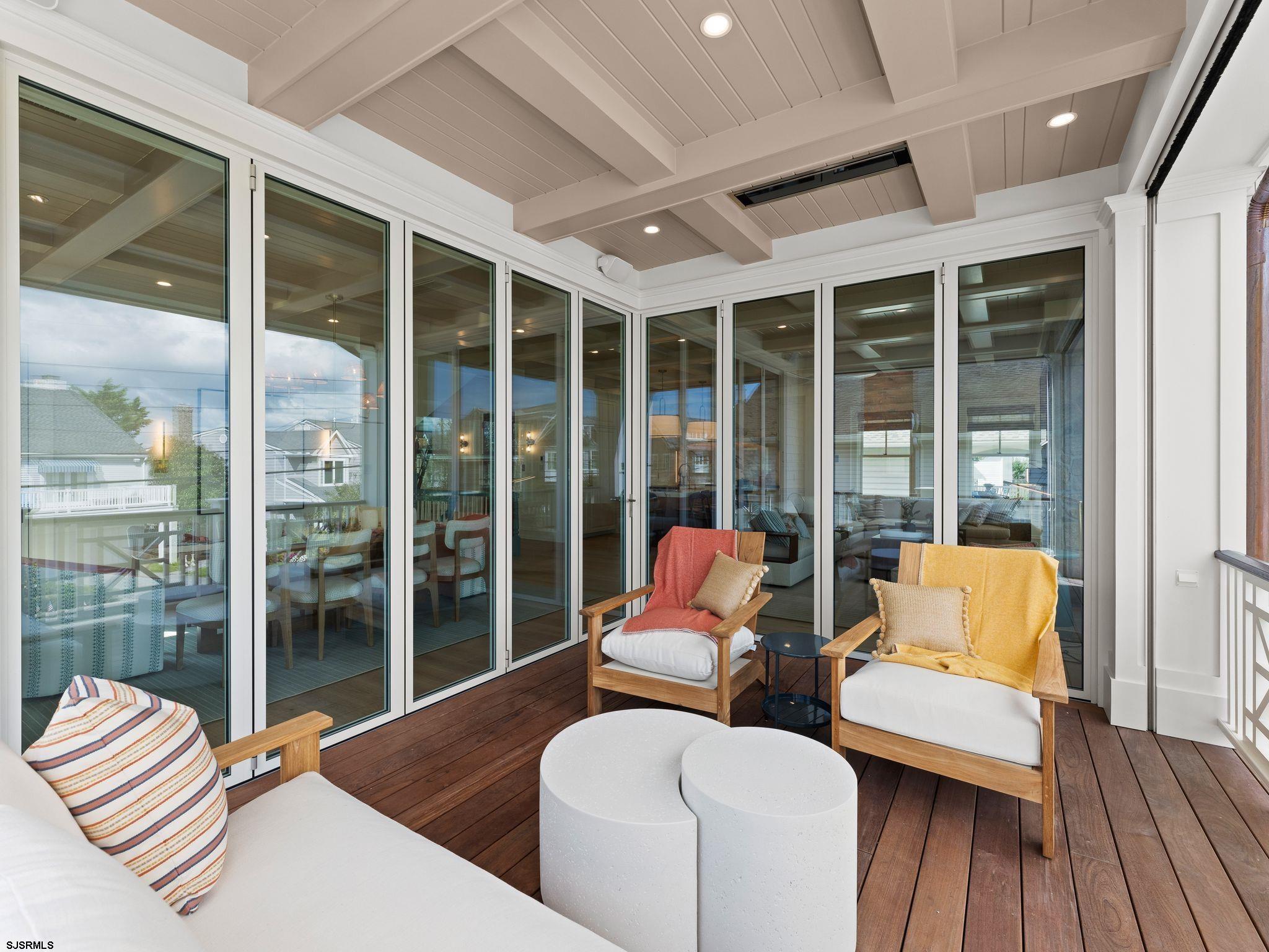12 East Newcastle Road Ocean City, NJ 08226 - Photo 33 of 99 a living room with furniture and a large window