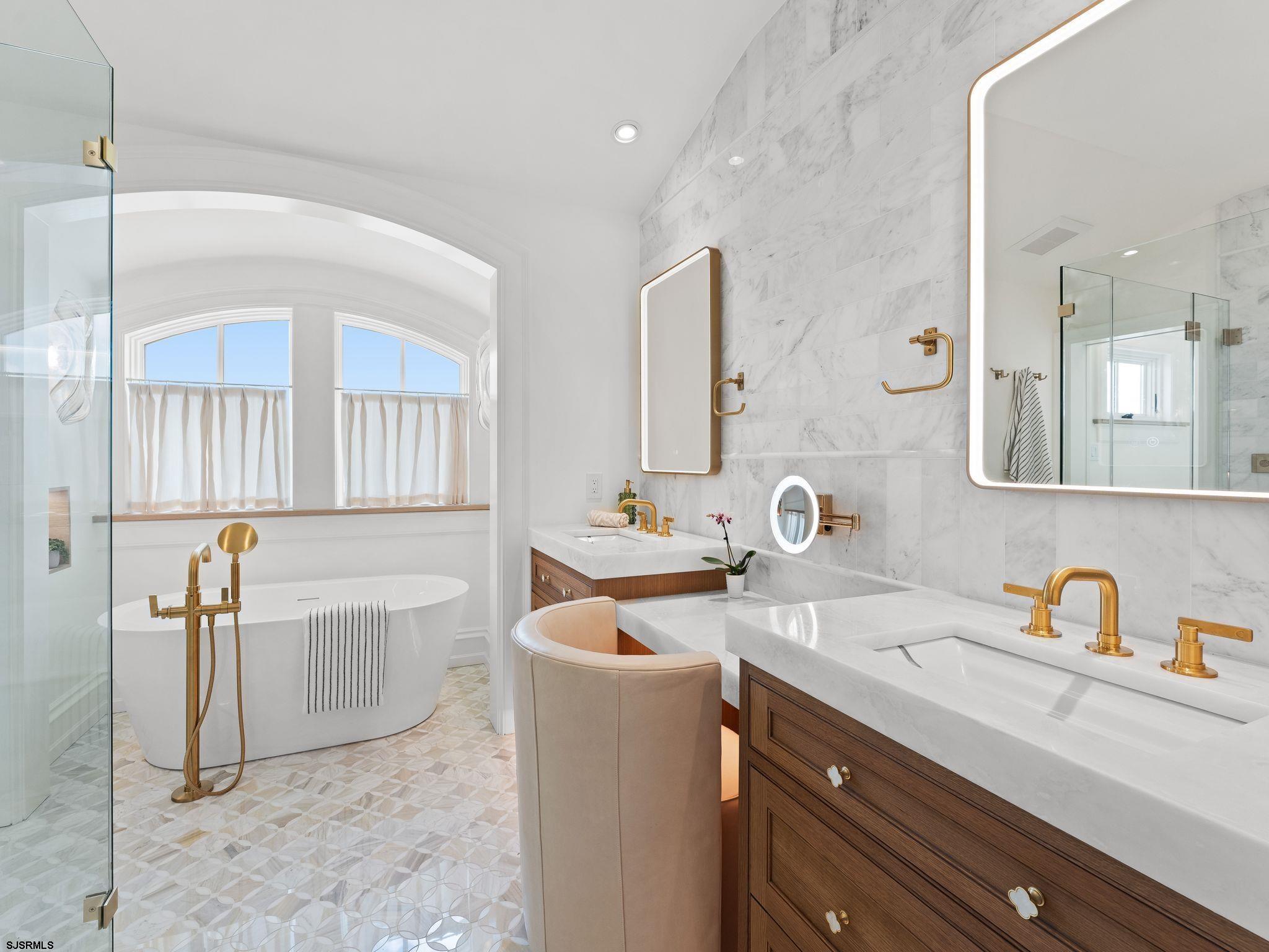 12 East Newcastle Road Ocean City, NJ 08226 - Photo 43 of 99 a bathroom with a sink double vanity and a mirror