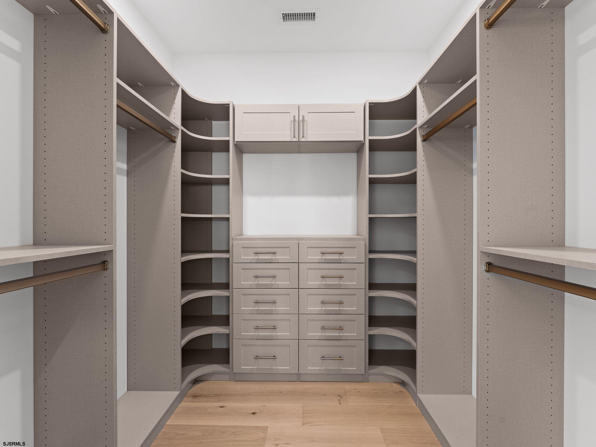 12 East Newcastle Road Ocean City, NJ 08226 - Photo 48 of 99 a view of walk in closet with clothes and shoes