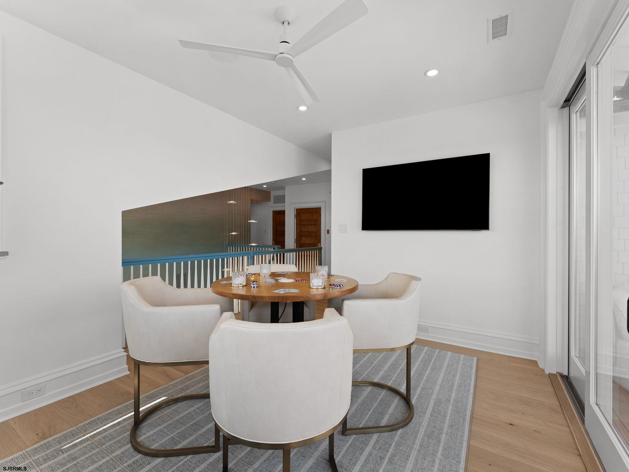 12 East Newcastle Road Ocean City, NJ 08226 - Photo 50 of 99 a living room with furniture and a flat screen tv