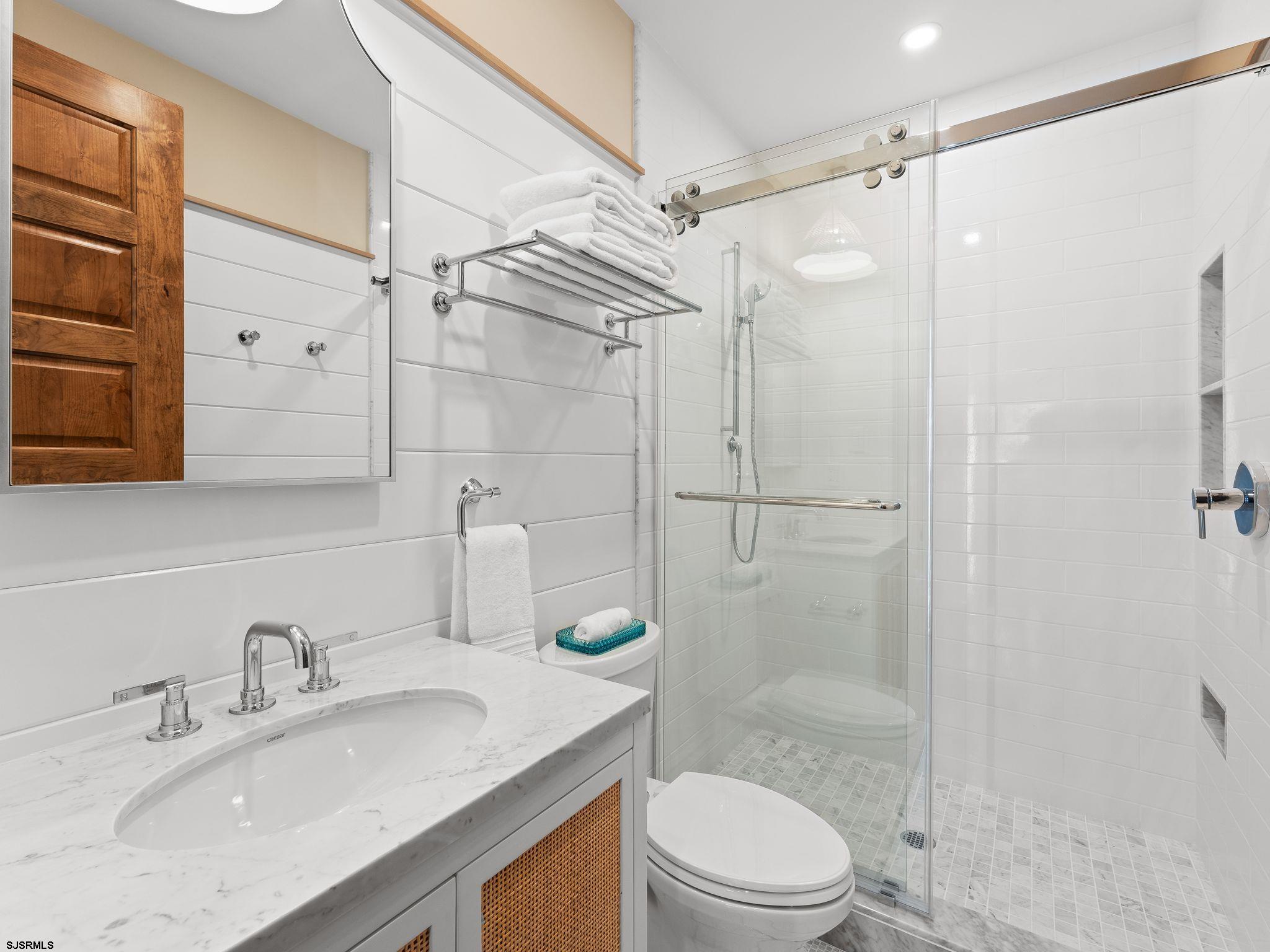 12 East Newcastle Road Ocean City, NJ 08226 - Photo 58 of 99 a bathroom with a granite countertop sink toilet and shower