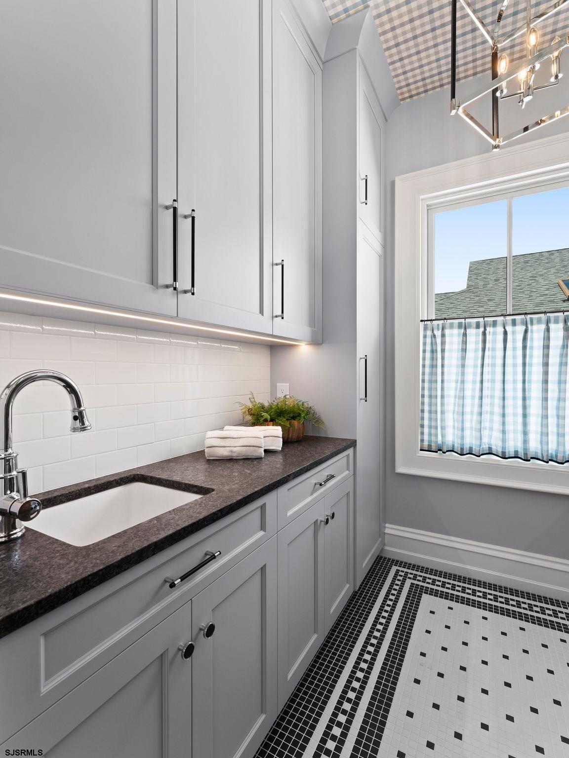 12 East Newcastle Road Ocean City, NJ 08226 - Photo 60 of 99 a kitchen with granite countertop a sink and cabinets