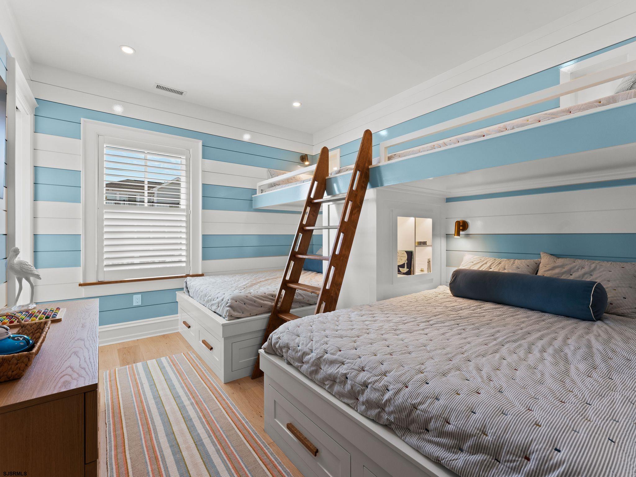 12 East Newcastle Road Ocean City, NJ 08226 - Photo 62 of 99 a bedroom with a bed and wooden floor