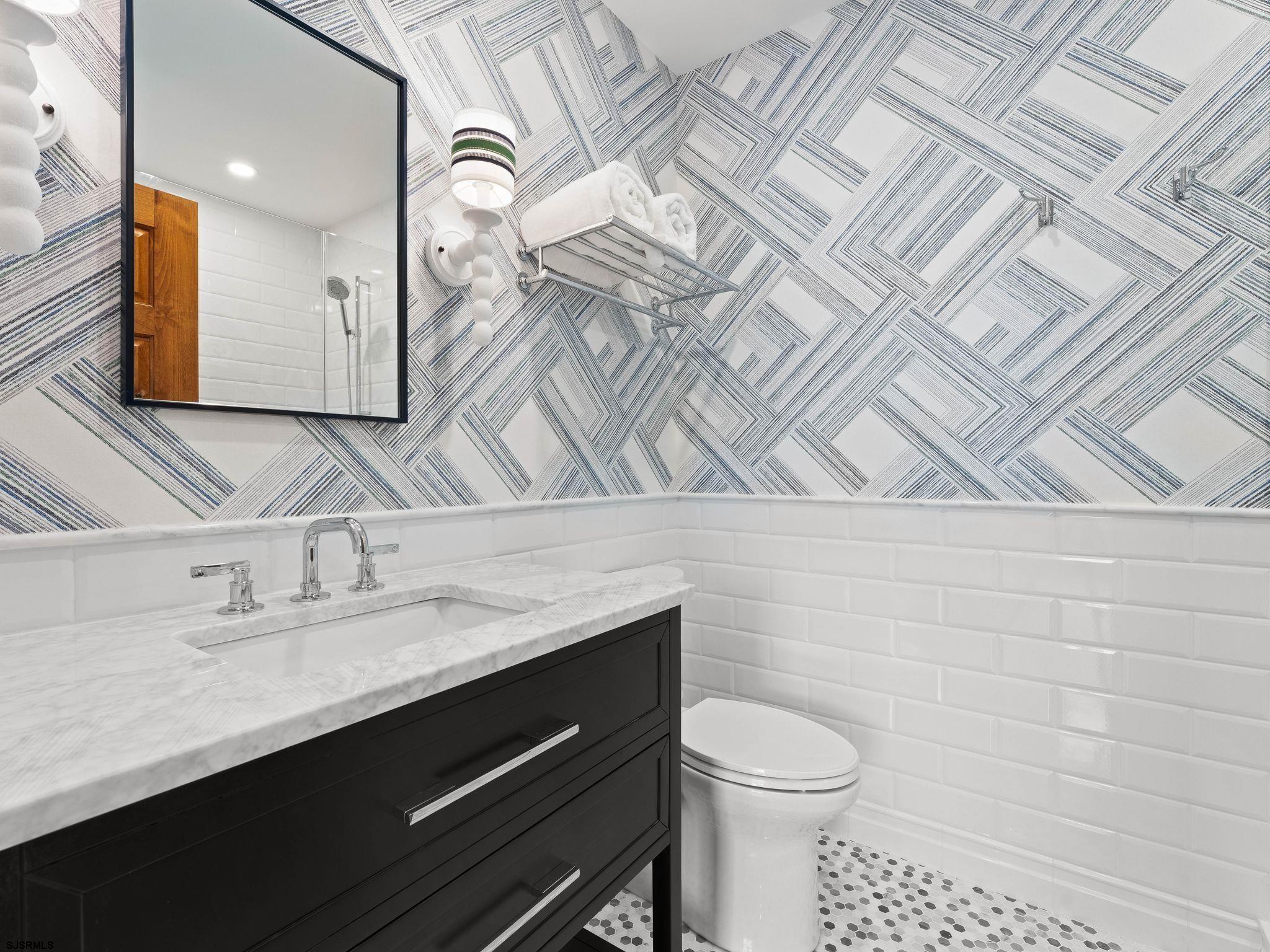 12 East Newcastle Road Ocean City, NJ 08226 - Photo 68 of 99 a bathroom with a granite countertop sink and a toilet