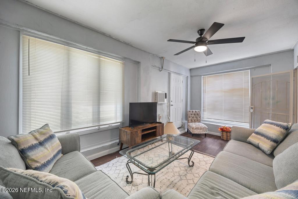 5210 Dodge Road Jacksonville, FL 32209 - Photo 31 of 42 a living room with furniture and a flat screen tv