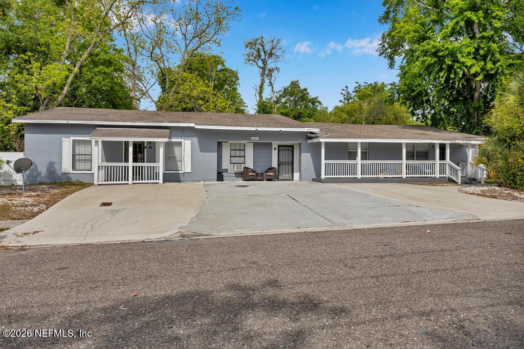 5210 Dodge Road Jacksonville, FL 32209 - Photo 5 of 42 front view of a house with a patio