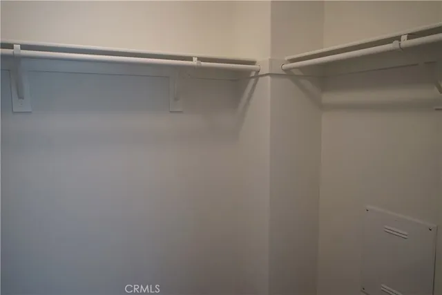 a bathroom with a granite countertop sink and a window