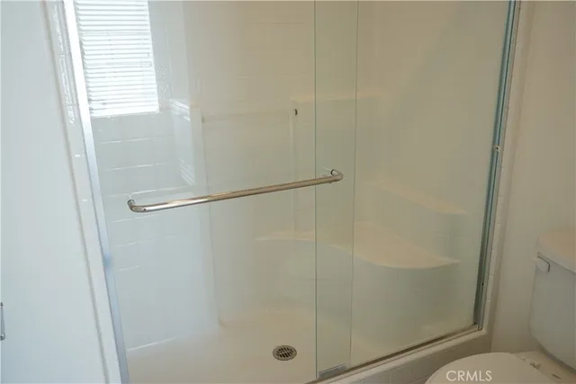 a view of a room with wall paintings and a rug