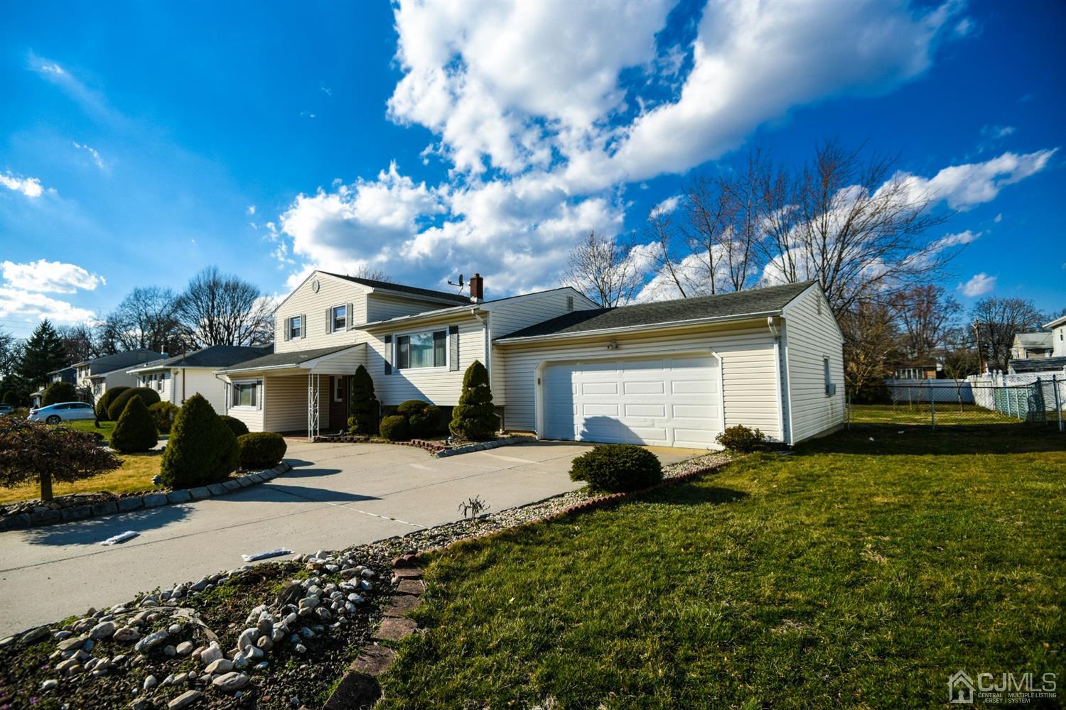 107 Calvert Avenue East Edison, NJ 08820 - Photo 3 of 28 a view of a house with a yard