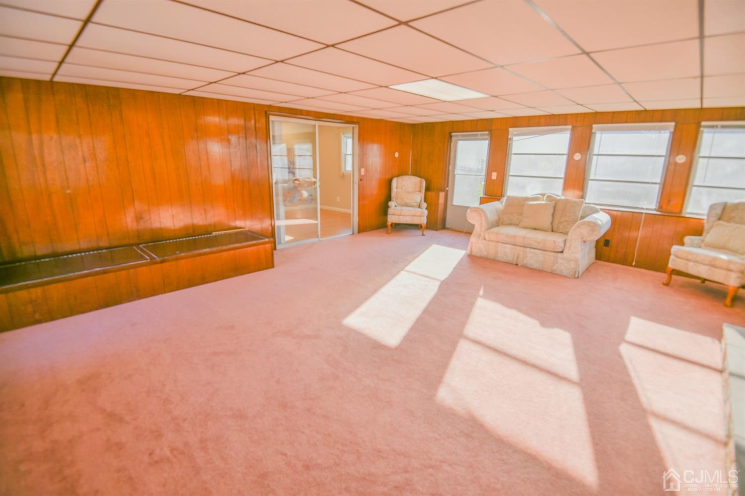107 Calvert Avenue East Edison, NJ 08820 - Photo 21 of 28 a spacious bedroom with a large bed and a large window