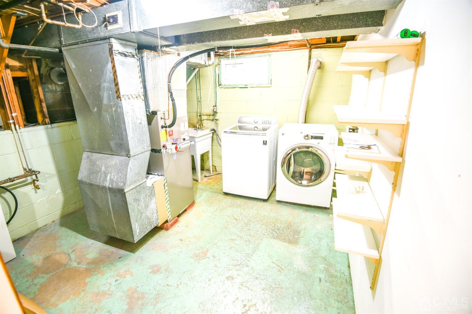 107 Calvert Avenue East Edison, NJ 08820 - Photo 23 of 28 a utility room with dryer and washer