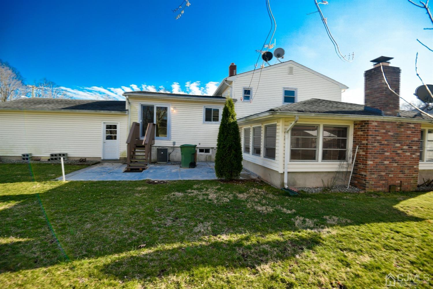 107 Calvert Avenue East Edison, NJ 08820 - Photo 25 of 28 a view of a house with backyard