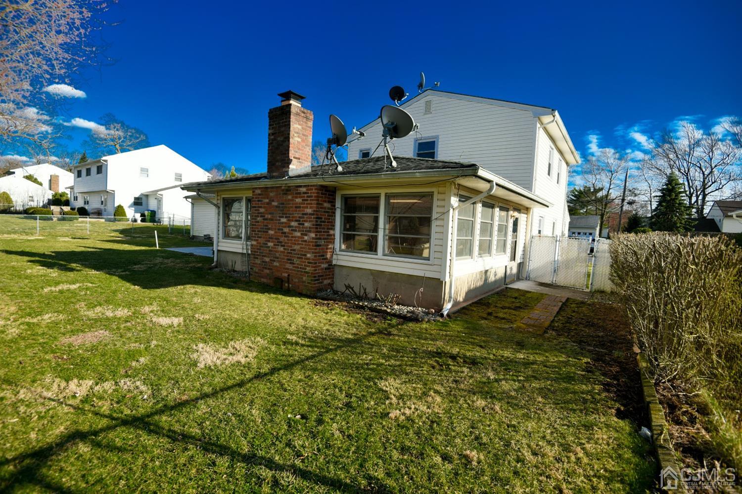 107 Calvert Avenue East Edison, NJ 08820 - Photo 28 of 28 a view of a house with a yard