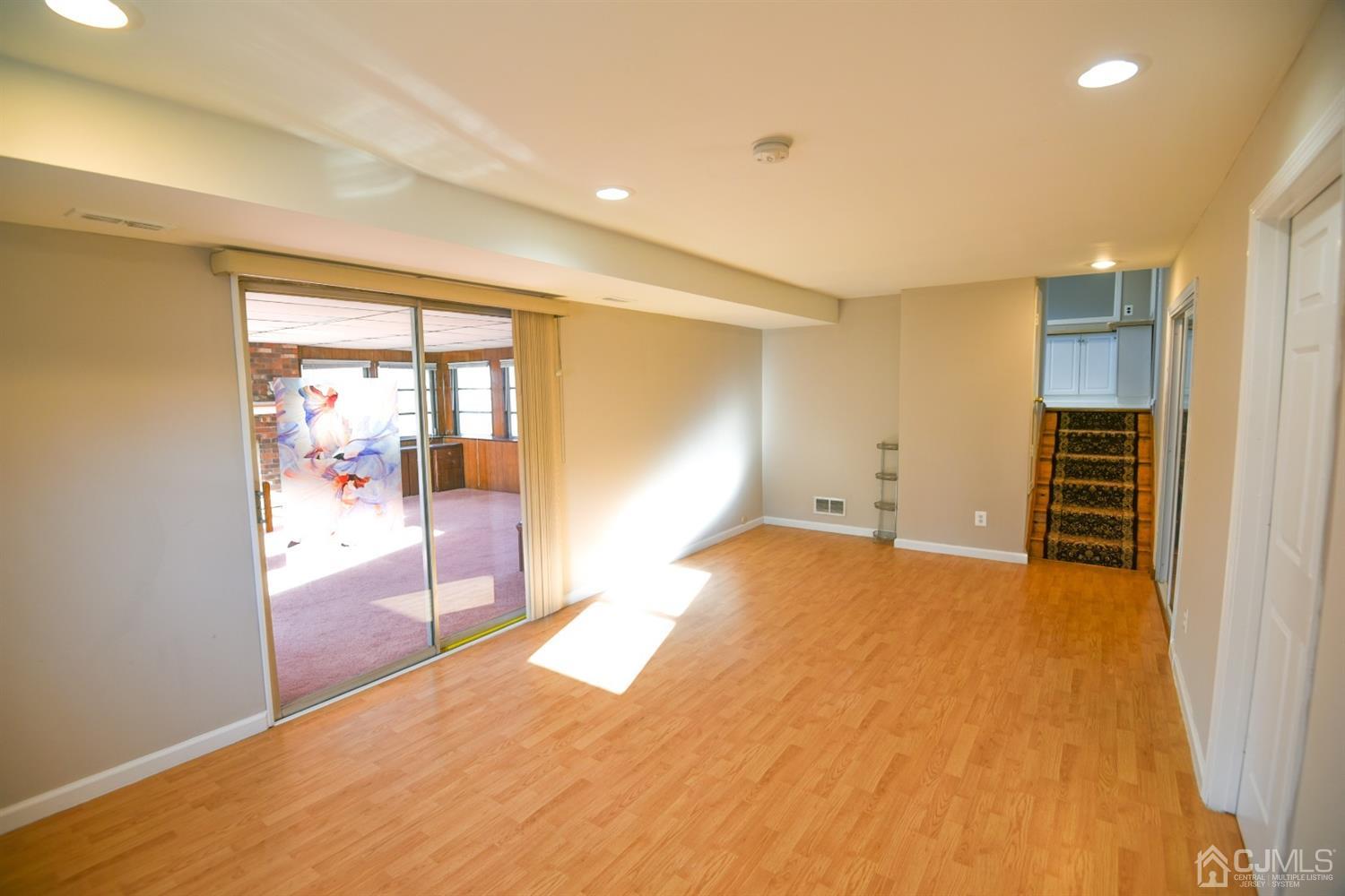 107 Calvert Avenue East Edison, NJ 08820 - Photo 9 of 28 a view of an empty room with a window
