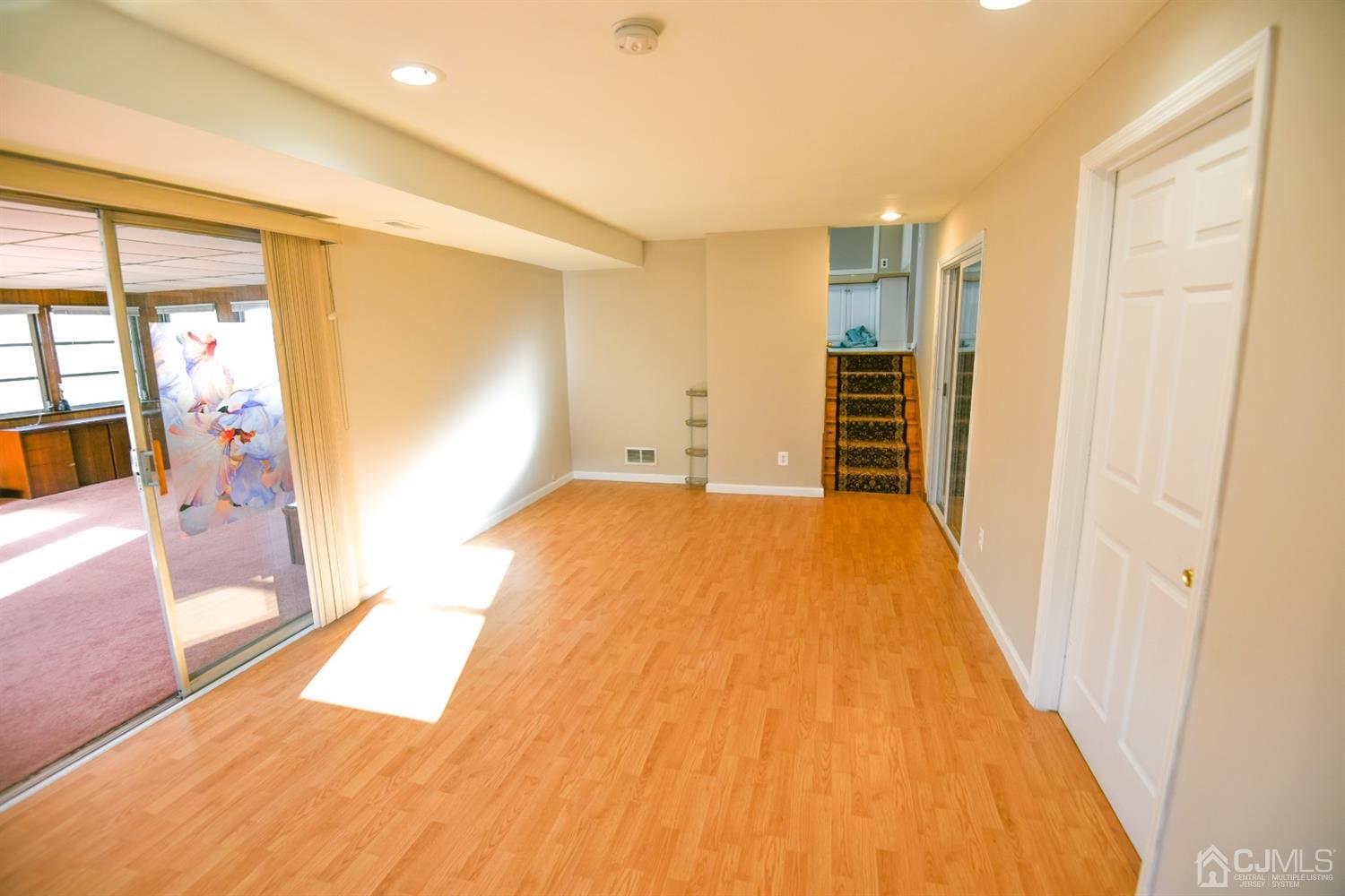 107 Calvert Avenue East Edison, NJ 08820 - Photo 10 of 28 a bedroom with a bed and wooden floor