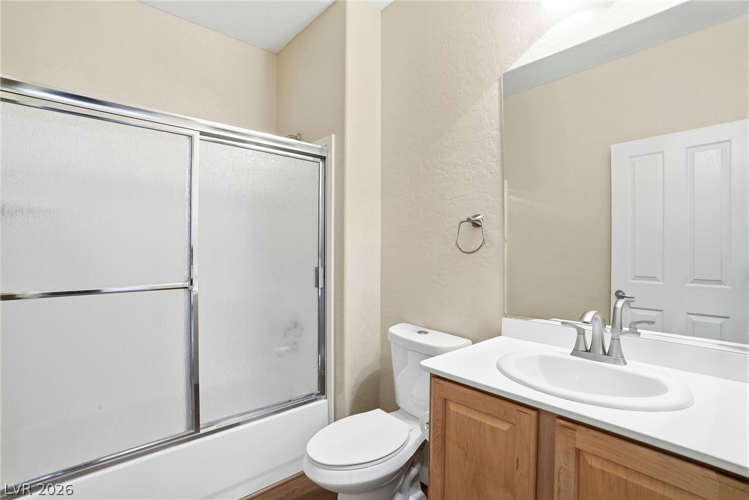 2541 Darda Street Henderson, NV 89044 - Photo 11 of 26 This bright bathroom features a spacious tub and shower combination with a single vanity.