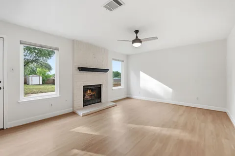 a view of a kitchen with microwave and cabinets
