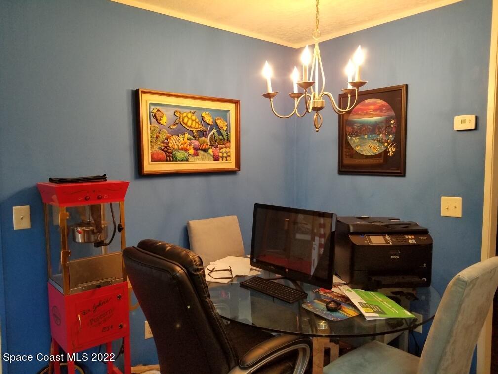 4051 Fountain Palm Road Cocoa, FL 32926 - Photo 12 of 25 a view of a workspace with furniture