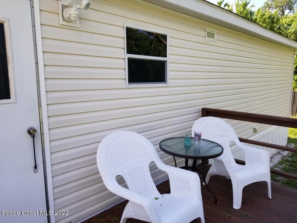 4051 Fountain Palm Road Cocoa, FL 32926 - Photo 20 of 25 a view of a balcony with table and chairs