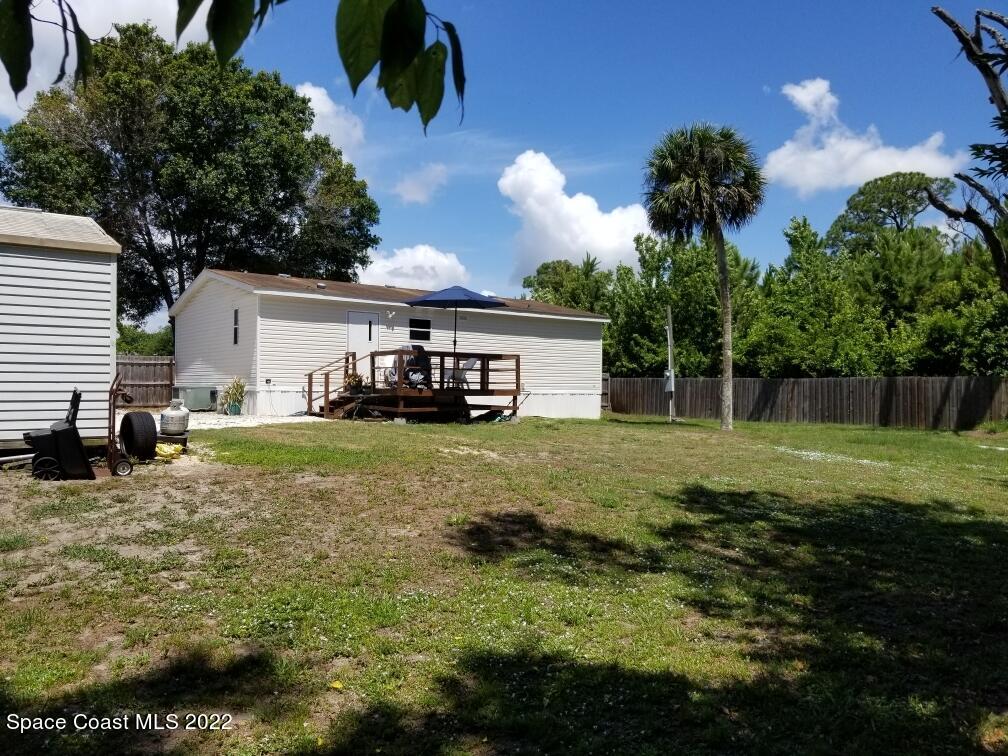 4051 Fountain Palm Road Cocoa, FL 32926 - Photo 24 of 25 a view of a house with backyard