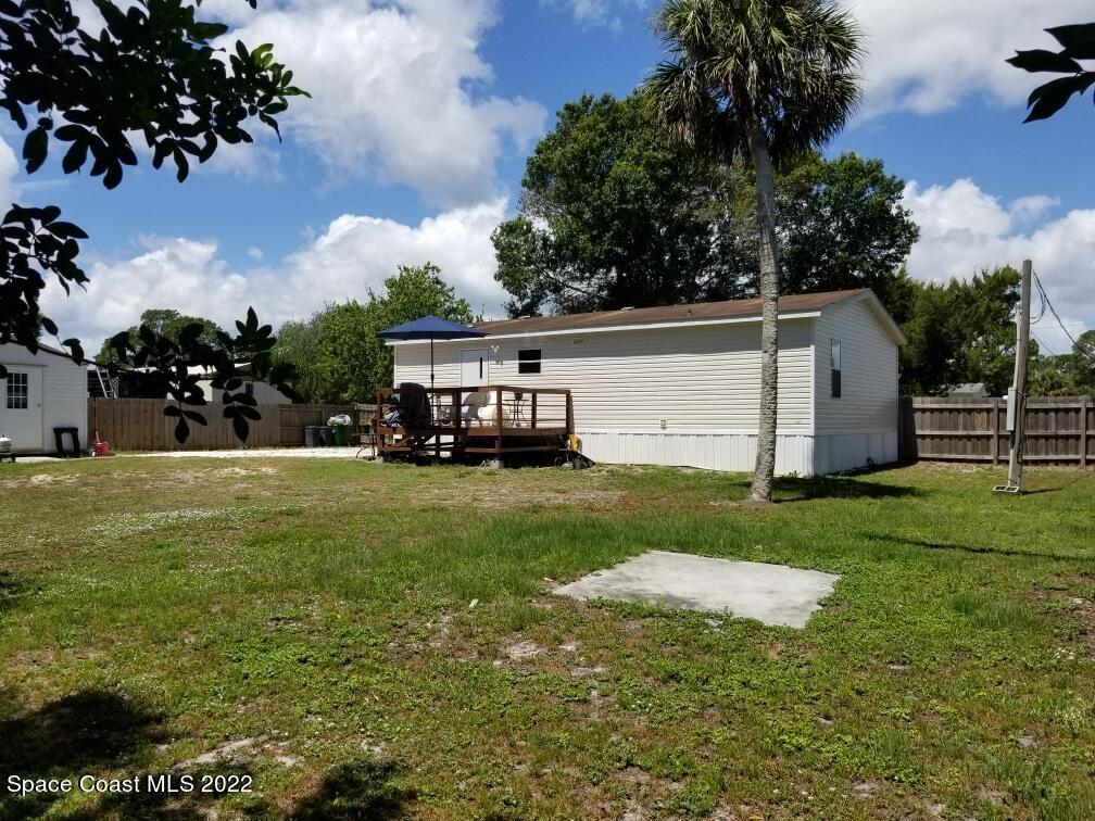 4051 Fountain Palm Road Cocoa, FL 32926 - Photo 25 of 25 a view of a house with a back yard