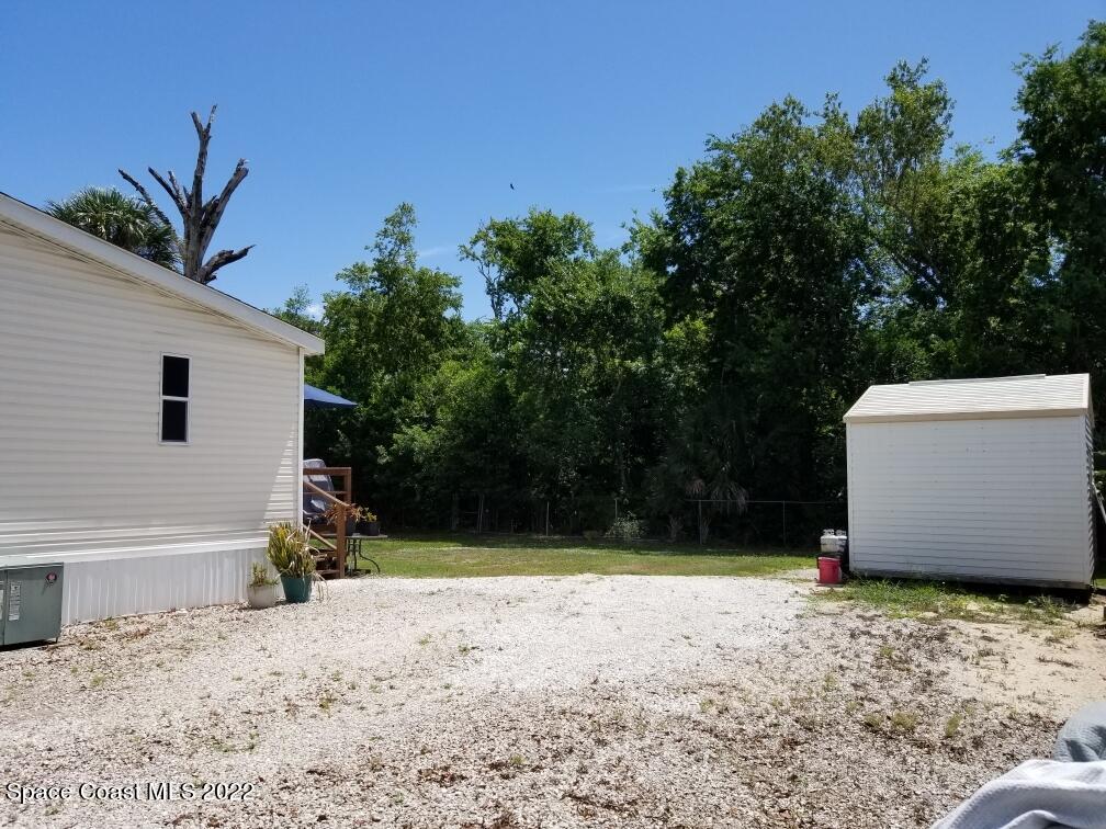 4051 Fountain Palm Road Cocoa, FL 32926 - Photo 5 of 25 a view of backyard space and trees