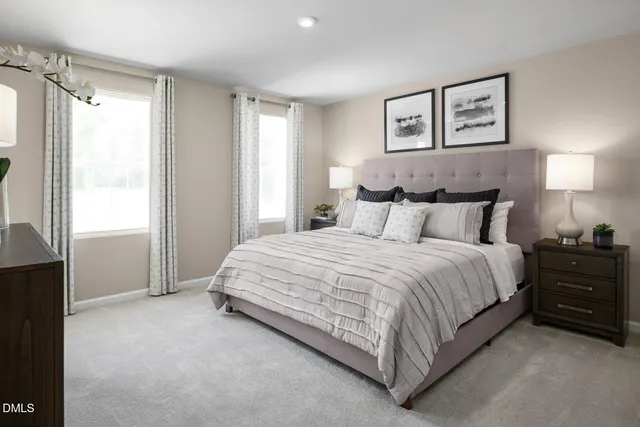 a spacious bedroom with a bed and a window