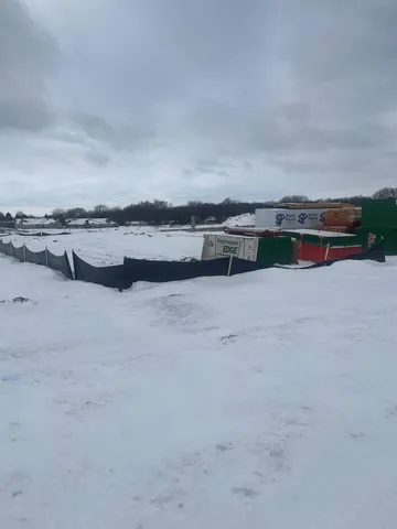 a view of a lake with houses in the back