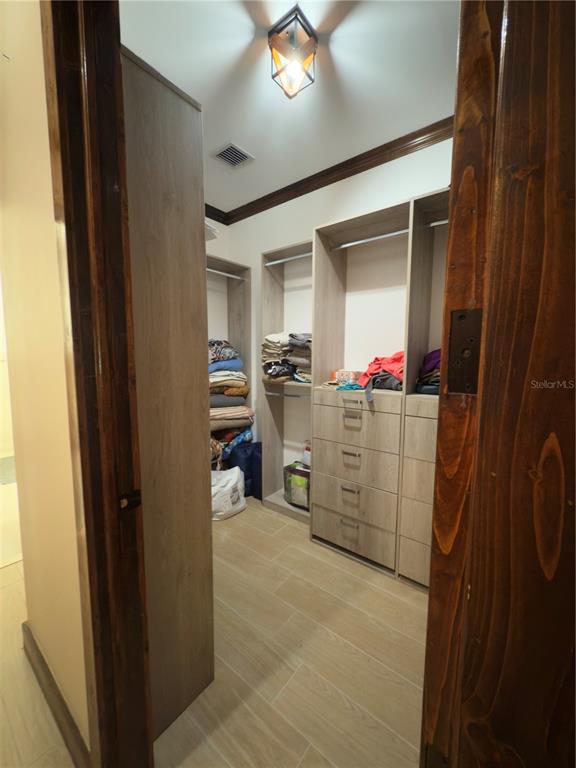 842 Hunting Club Avenue Clewiston, FL 33440 - Photo 14 of 34 a room with storage and utility